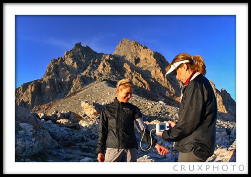 Checking Kelly Perkins' Blood Pressure at 11,610 feet at the lower Saddle.  Copyright Nate Young and Crux Photo.
